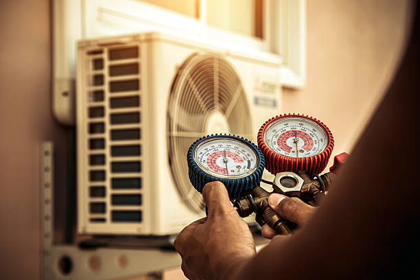Professional Air Conditioning Service technician working in Derby, KS